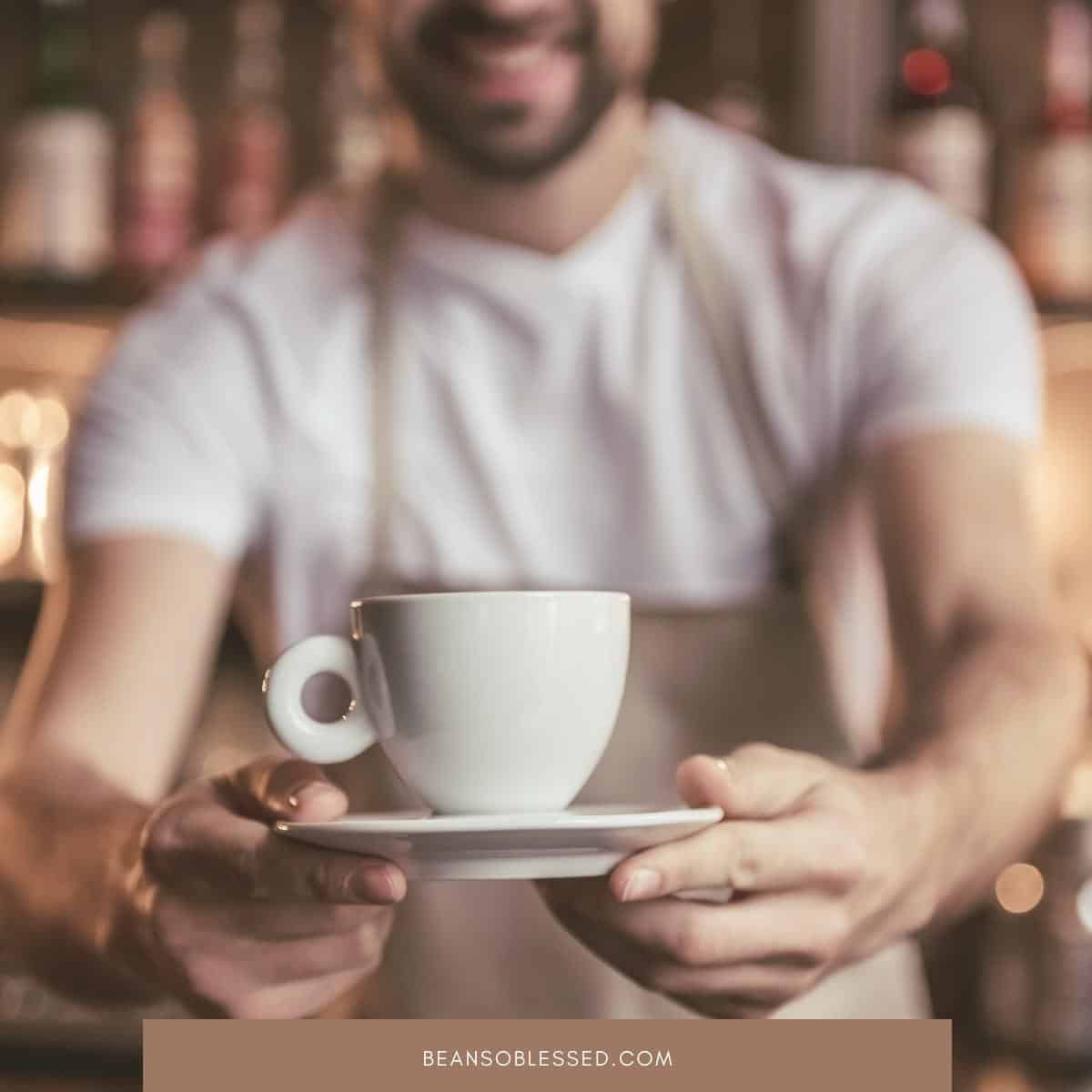 image of barista with cup in his hand for the post 5 Barista Duties and How They Take Coffee To A New Level the post