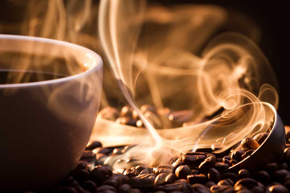 image of Strange golden smoke taking away from coffee seeds for home page of beansoblessed